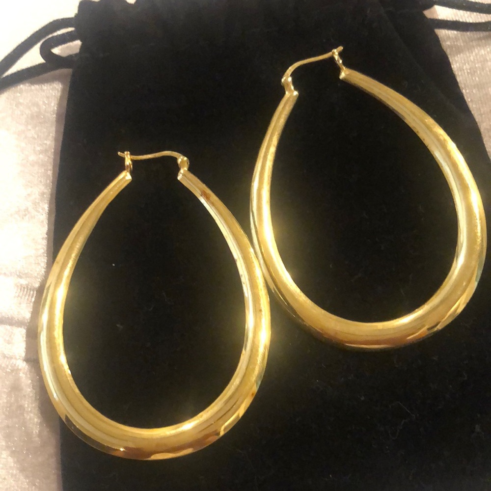 Large gold oval shaped earrings